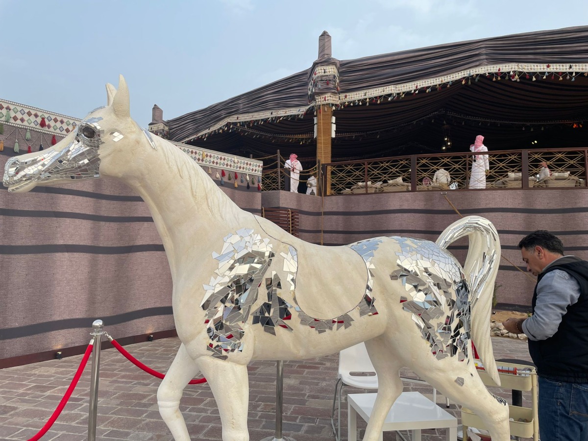 Tarek Maarkach working on his life-size horse mirror mosaic. Pics: Joelyn Baluyut/The Peninsula