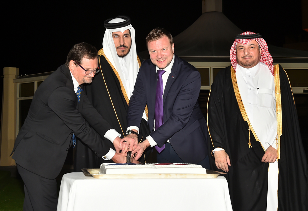 Minister of Commerce and Industry, H E Sheikh Mohammed bin Hamad bin Qassim Al Thani (second left); Minister of Development Cooperation and Foreign Trade of Finland, H E Ville Skinnari (second right); Director of Protocol Department at the Ministry of Foreign Affairs, H E Ambassador Ibrahim Yousef Fakhroo (first right); and Finland’s Ambassador to Qatar H E Pekka Voutilainen cut a cake at the opening of Finnish embassy in Doha yesterday. PIC: ABDUL BASIT  