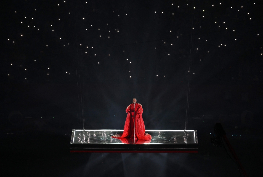 Barbadian singer Rihanna performs during the halftime show of Super Bowl LVII between the Kansas City Chiefs and the Philadelphia Eagles at State Farm Stadium in Glendale, Arizona, on February 12, 2023. (Photo by Angela Weiss / AFP)