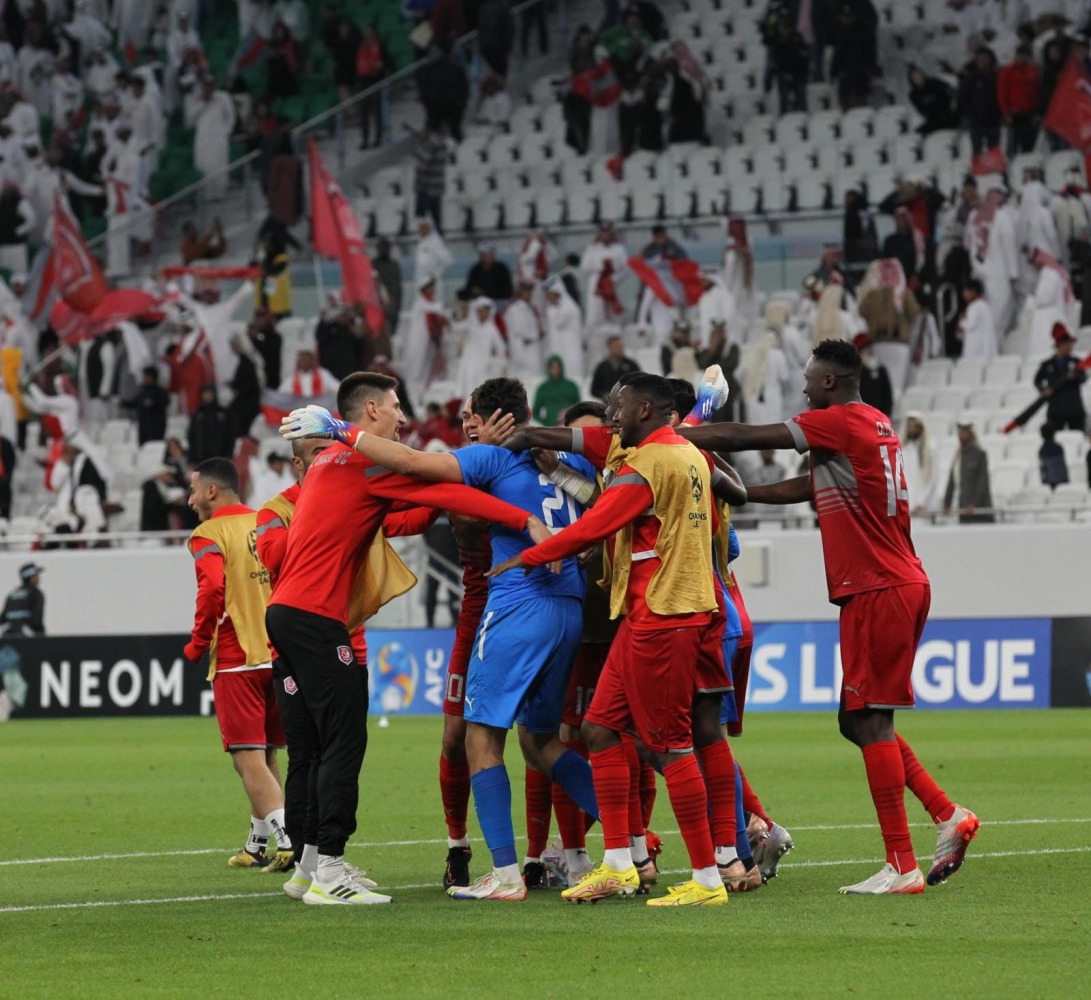 Al Duhail players celebrate at the end of their  AFC Champions League (West) 2022 match against Al Rayyan in an all-Qatar Round of 16 clash at Al Thumama Stadium in Doha on Sunday. Photos:  Salim Matramkot / The Peninsula