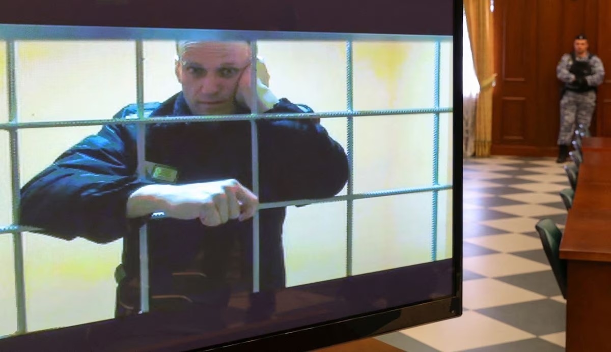 File Photo: Russian opposition leader Alexei Navalny is seen on a screen via a video link from the IK-2 corrective penal colony in Pokrov during a court hearing to consider an appeal against his prison sentence in Moscow, Russia, May 24, 2022. (REUTERS/Evgenia Novozhenina)