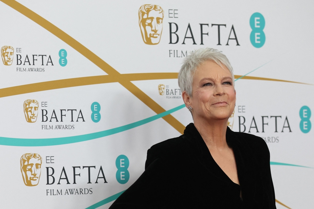 US actress Jamie Lee Curtis poses on the red carpet upon arrival at the BAFTA British Academy Film Awards at the Royal Festival Hall, Southbank Centrer, in London, on February 19, 2023. (Photo by ISABEL INFANTES / AFP)