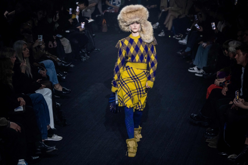 A model presents a creation for British fashion house Burberry during the catwalk show for their Autumn/Winter 2023 collection on the fourth day of the London Fashion Week, in London, on February 20, 2023. (Photo by Niklas HALLE'N / AFP)