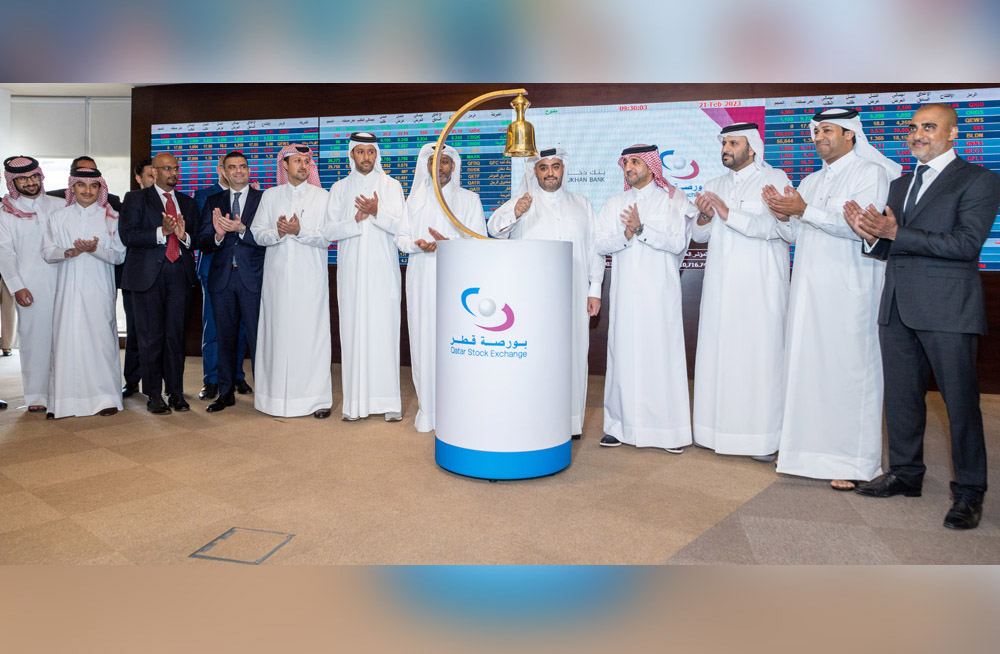 Dukhan Bank and QSE officials during the listing ceremony held yesterday at the QSE building.