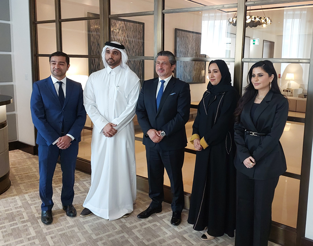 Microsoft Qatar and SAP officials pose for a photograph at the launch of the partnership.