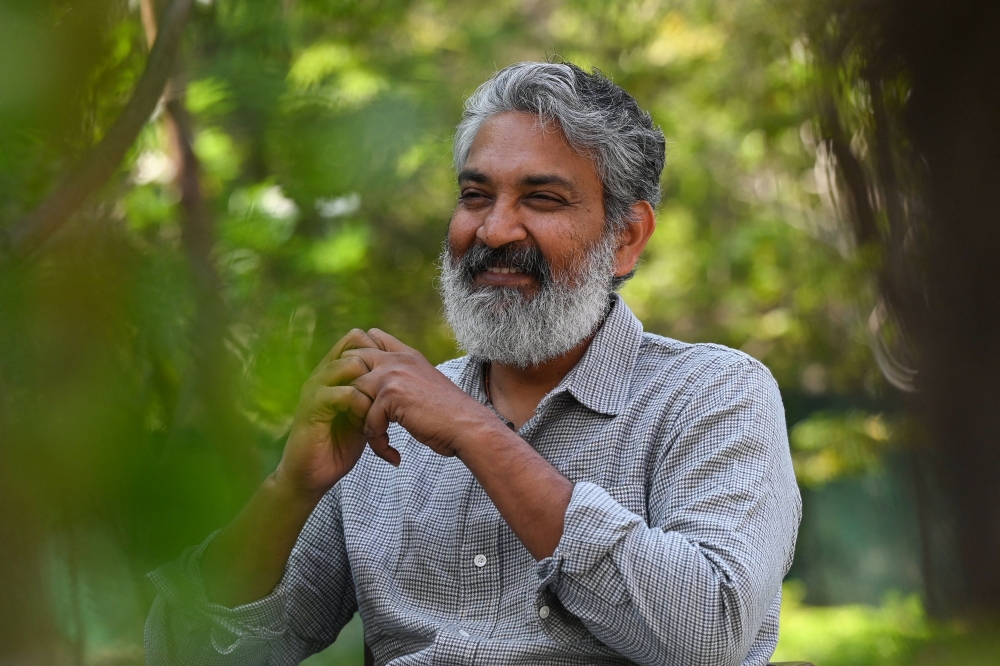 In this picture taken on February 22, 2023, Indian film director S.S. Rajamouli gestures during an interview with AFP at the RRR office on the outskirts of Hyderabad. (Photo by Noah Seelam / AFP) 