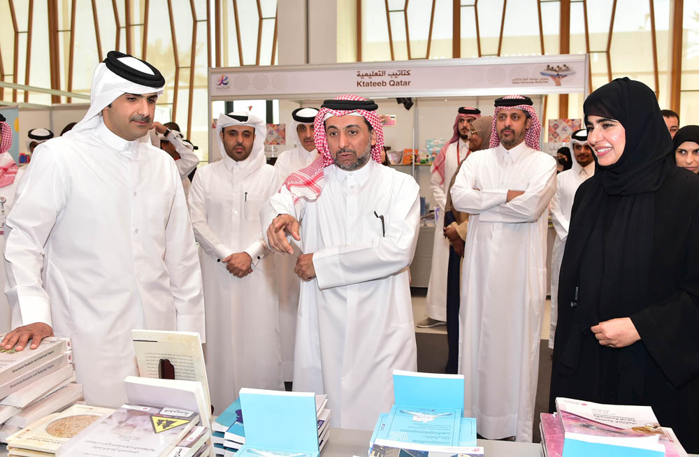 From LEFT: Minister of Culture H E Sheikh Abdul Rahman bin Hamad bin Jassim Al Thani, QU President Dr. Hassan Al Derham and Vice President for Research and Graduate Studies Prof Mariam Al Maadeed tour the QU Book Fair.