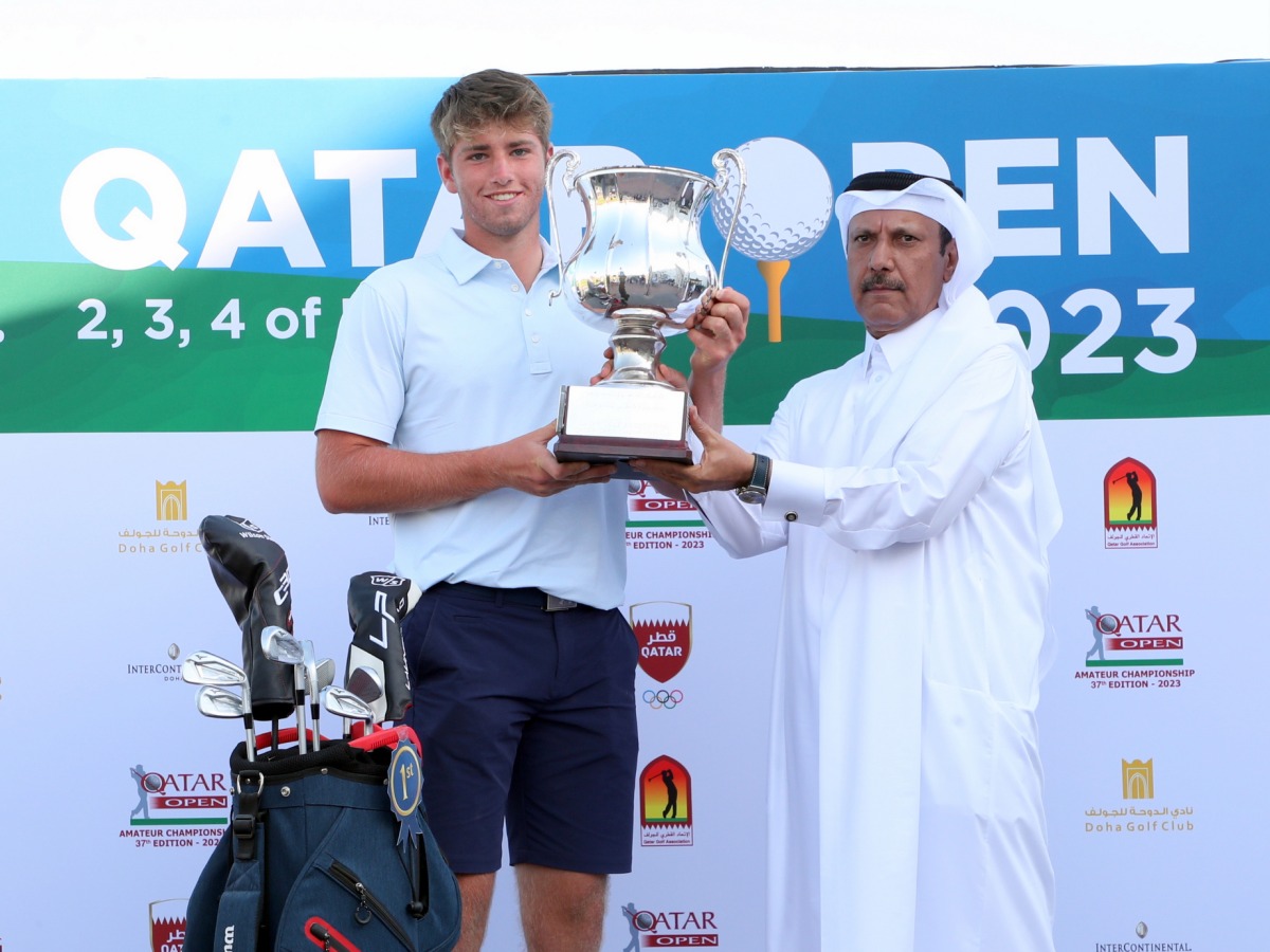 Qatar Golf Association's Deputy General-Secretary Eng. Mohammed Ibrahim Al Muhannadi presents the trophy to Joe Jones.