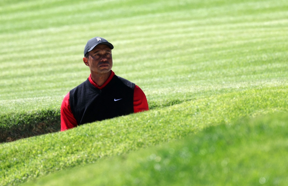 Tiger Woods of the United States reacts to his shot out of a bunker on the 17th hole during the final round of the The Genesis Invitational at Riviera Country Club on February 19, 2023 in Pacific Palisades, California. (Harry How/Getty Images/AFP)

