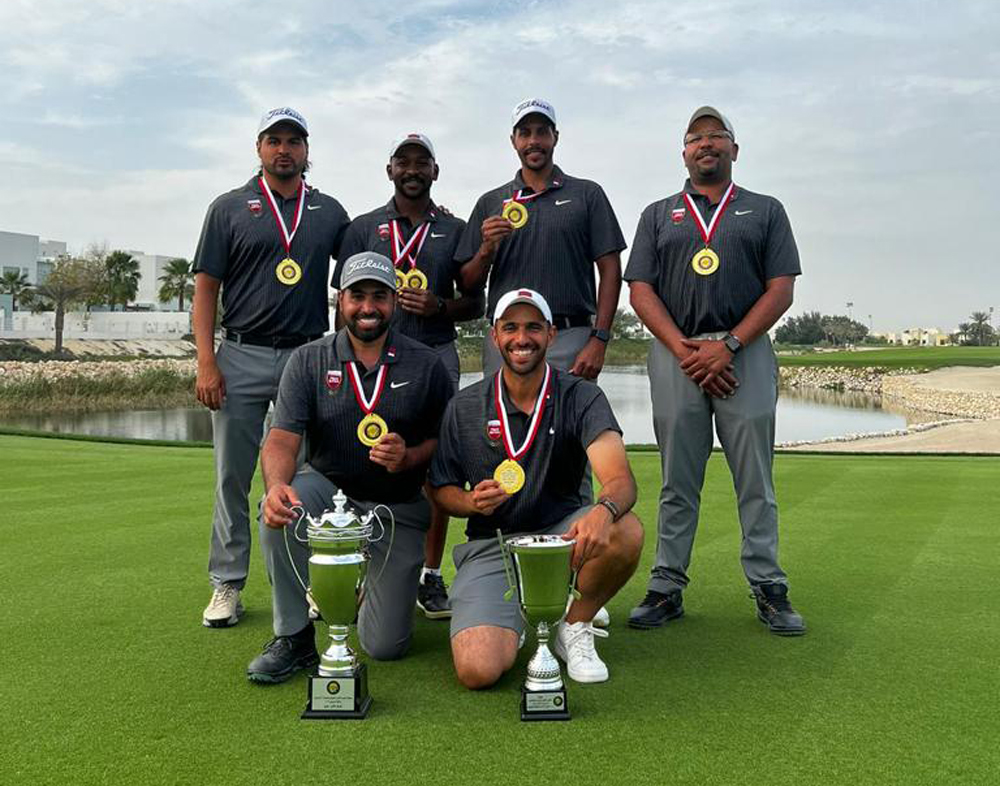 Team Qatar golfers pose with their trophies.