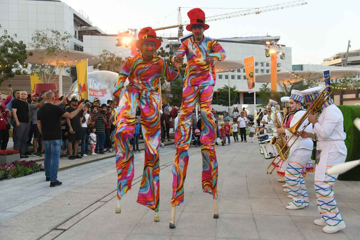 Visitors enjoy a presentation by Stilt Walkers during the opening of the Qatar International Food Festival at Lusail Boulevard. All pictures: Amir Diab