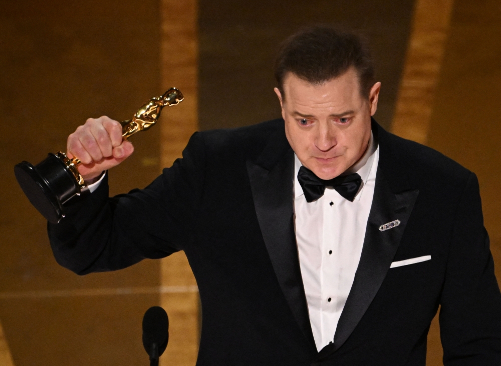 US actor Brendan Fraser accepts the Oscar for Best Actor in a Leading Role for 