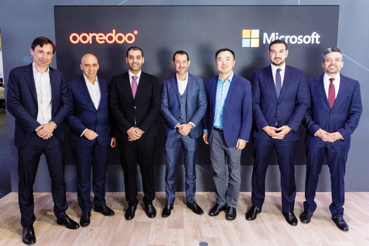 Aziz Aluthman Fakhroo, Managing Director and Group Chief Executive Officer at Ooredoo, with other officials from Ooredoo and Microsoft.