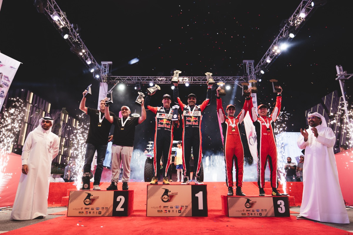 Qatar Motor and Motorcycle Federation (QMMF) President Abdulrahman Al Mannai and QMMF Executive Director Amro Al Hamad with the podium winners of the Qatar International Baja. Qatar’s Nasser Saleh Al Attiyah and co-driver Mathieu Baumel won the car category in their Toyota GR DKR Hilux.