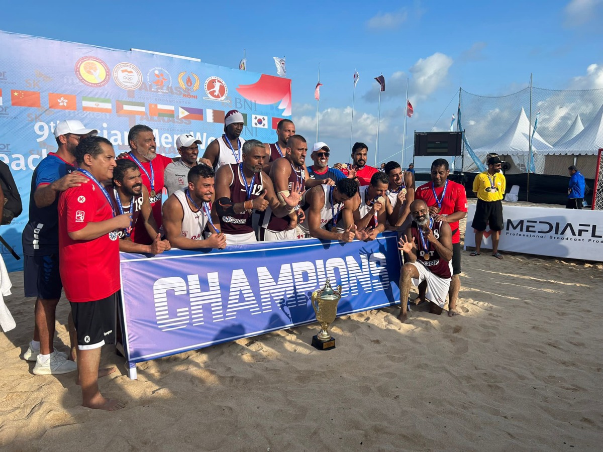 Qatar handball players and officials celebrate after winning the Asian title in Bali, yesterday.