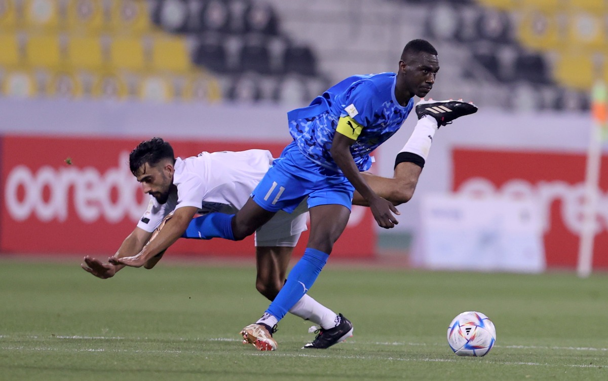 Al Duhail's Almoez Ali in action with an Al Sadd player during their Ooredoo Cup semi-final clash on Thursday. The final of the tournament will be played on March 28. 