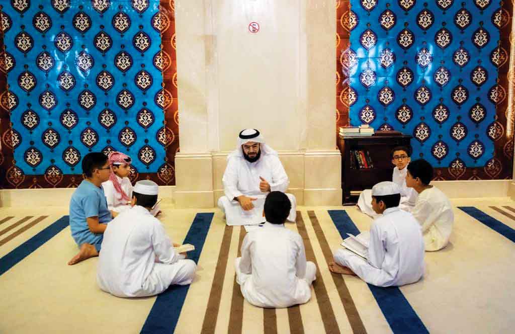 Children take part in a contest to memorise parts of the Holy Quran, as part of Ramadan activities, at the Katara Mosque. 