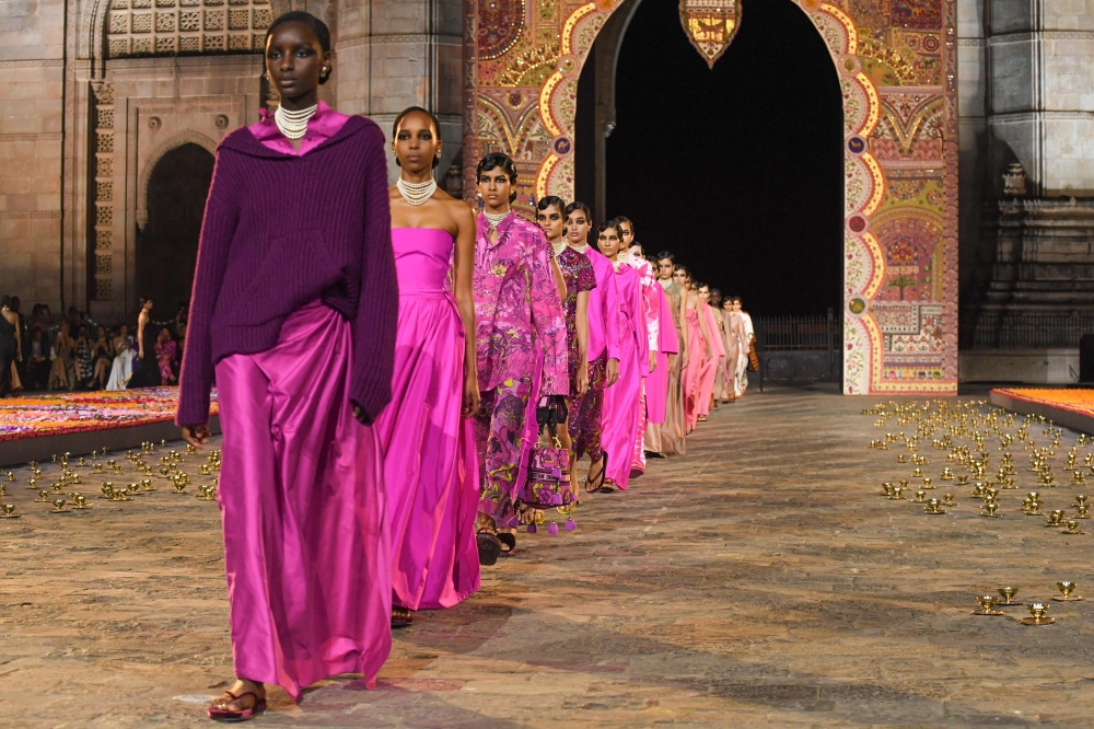 Models present creations from Christian Dior's Fall 2023 collection during a fashion show in Mumbai on March 30, 2023. (Photo by Indranil Mukherjee / AFP)