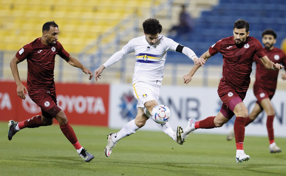 Ahmed Alaaeldin (centre) in action during match against Al Markhiya yesterday.  