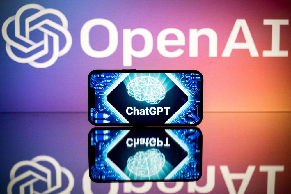 In this file photo taken on January 23, 2023 in Toulouse, southwestern France, shows screens displaying the logos of OpenAI and ChatGPT. Photo by Lionel BONAVENTURE / AFP