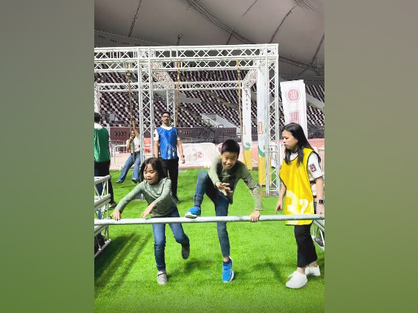 Children compete at the Obstacle Challenge at Khalifa International Stadium.