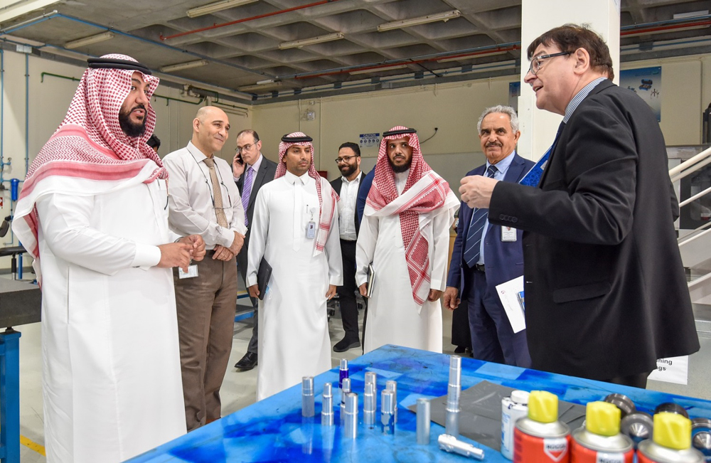 University of Doha for Science and Technology officials with the Saudi Arabian delegation during the visit to the university.