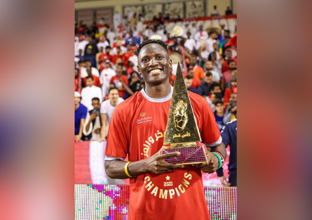 Al Duhail’s Michael Olunga poses with the Qatar Cup trophy the Red Knights won on April 6, 2023 after beating Al Sadd in the final. 