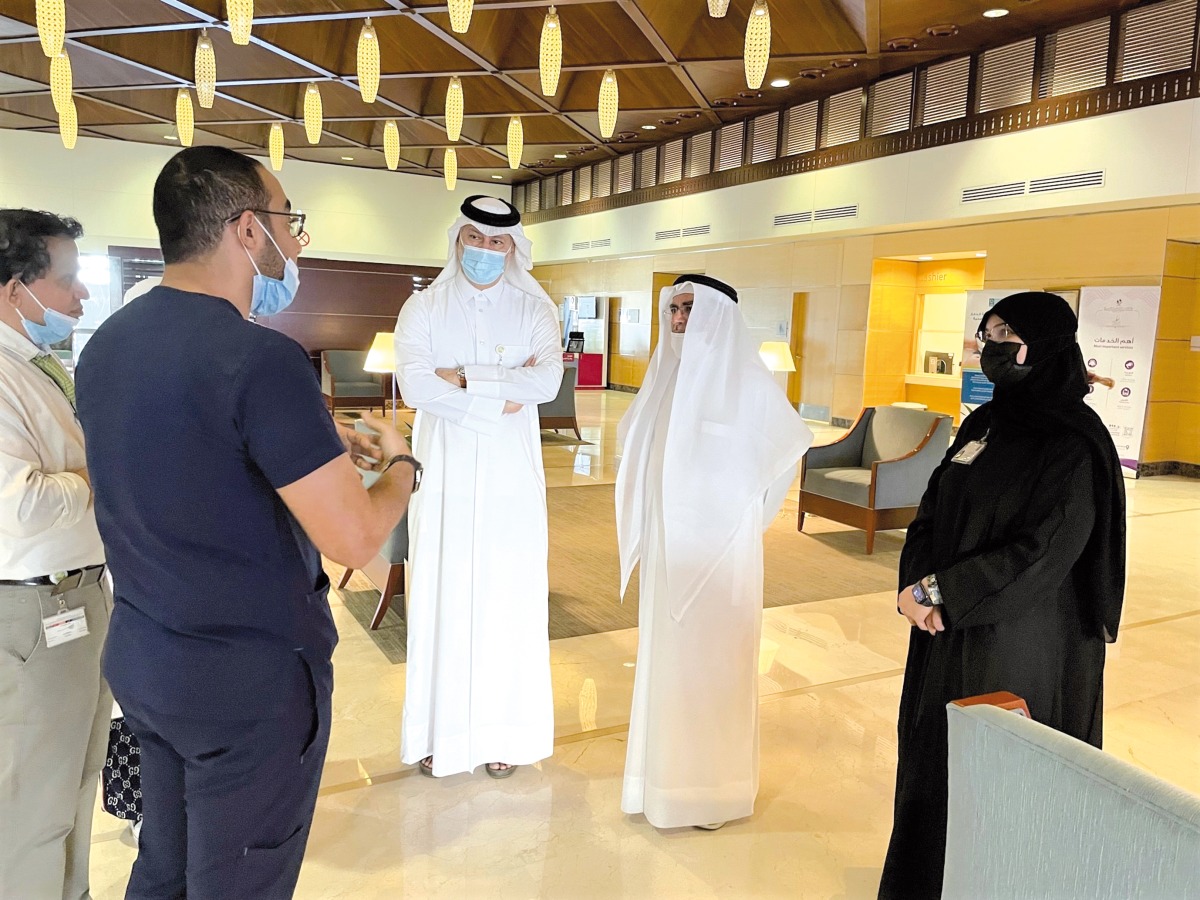 Dr. Abdulla Al Ansari, Chief Medical Officer at HMC; Dr. Hanadi Al Hamad,  Chairperson, Department of Geriatrics and Long-Term Care, with others during a  tour of delirium awareness activities at Hamad General hospital.  