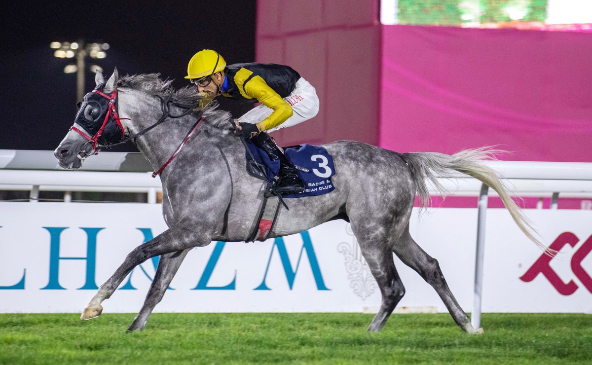 Al Balushi guides Ghannam to win at Al Rayyan Racecourse on Thursday night. Pics: Juhaim/QREC 