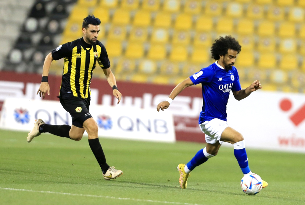 Al Sadd’s Akram Afif (right) in action yesterday. 