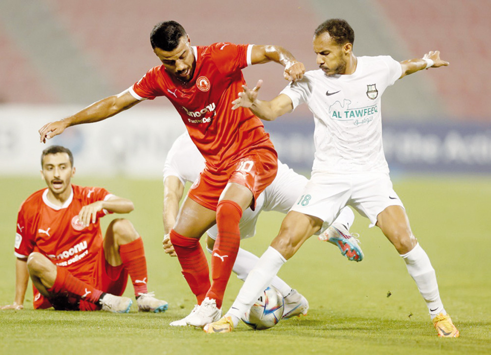 Action during the match between Al Arabi and Al Ahli. 