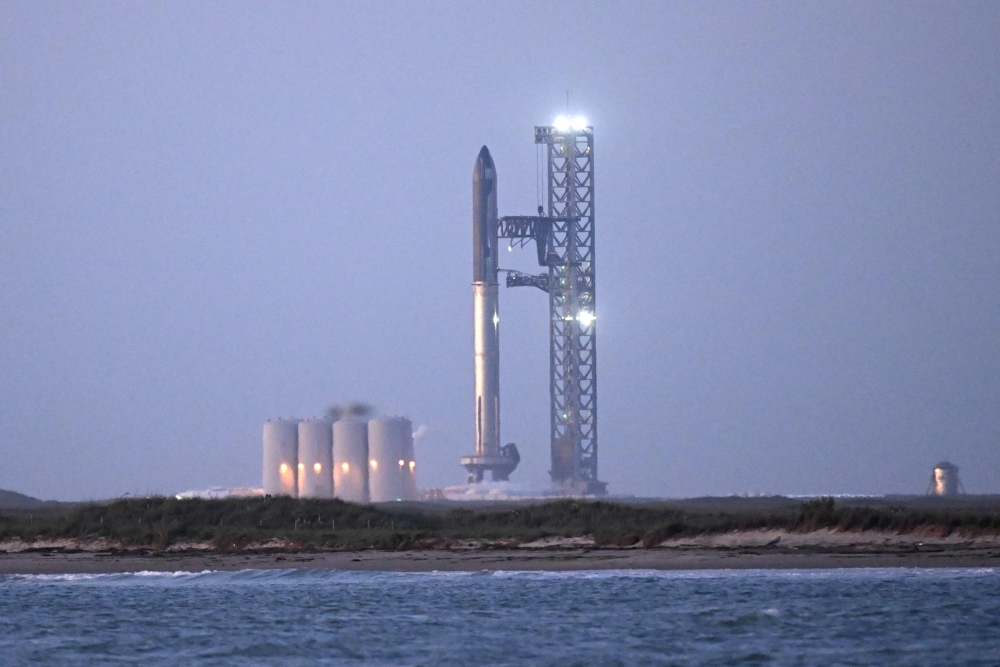 A view of the SpaceX Starship as it stands on the launch pad ahead of a flight test from Starbase in Boca Chica, Texas, early on April 17, 2023. Photo by Patrick T. Fallon / AFP