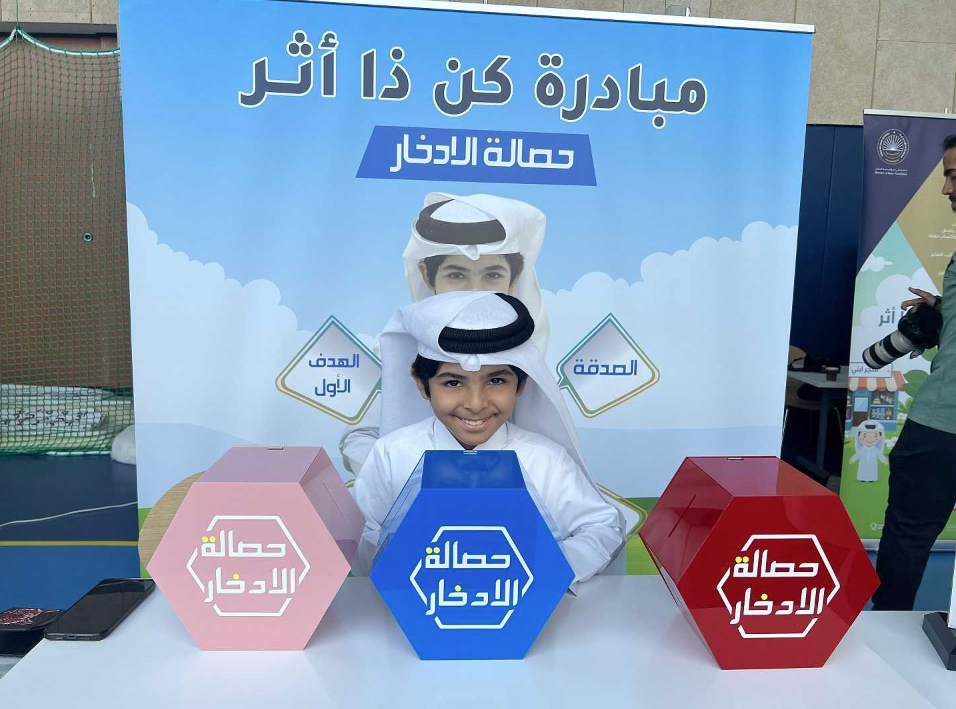 Jaber Al Muhannadi with his money-saving box. 