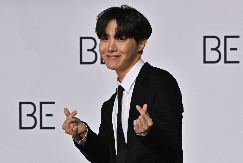 In this file photo taken on November 20, 2020 South Korean K-pop boy band BTS member J-Hope poses for a photo session during a press conference on BTS new album 'BE (Deluxe Edition)' in Seoul. Photo by Jung Yeon-je / AFP