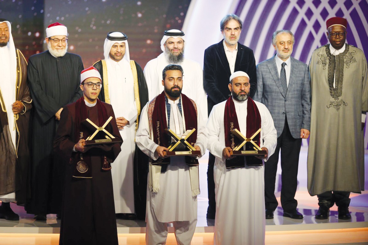 Officials with top three winners of the Katara Prize for Quran Recitation.