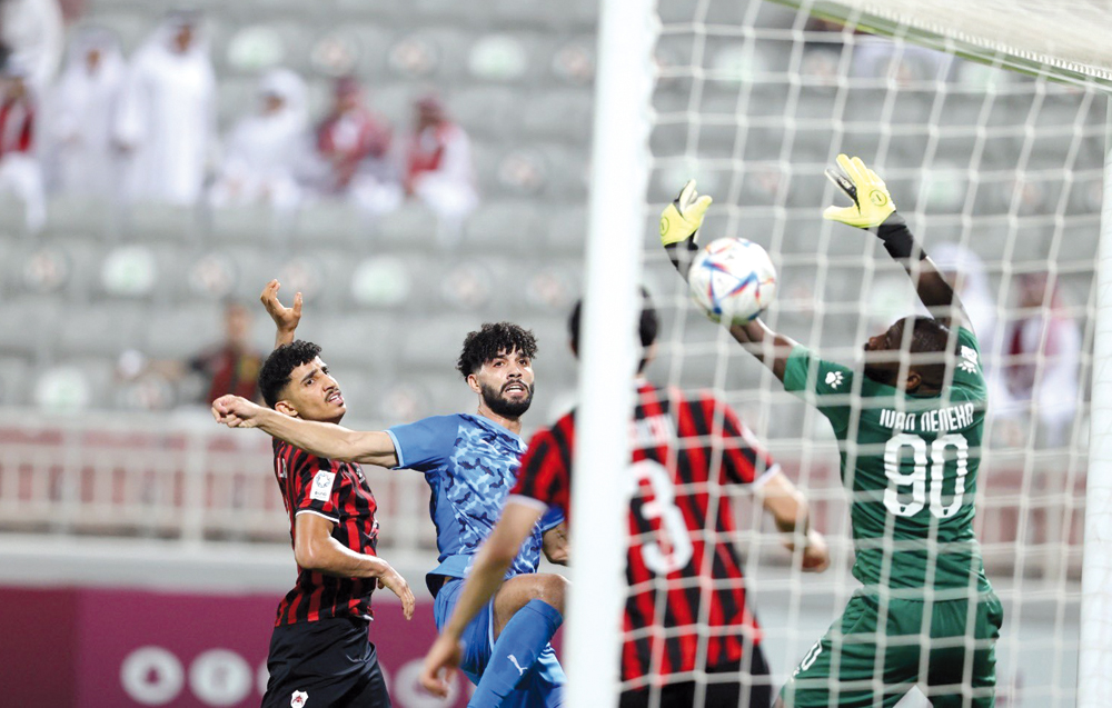 Ferjani Sassi (second left) scores Al Duhail's second goal yesterday. 