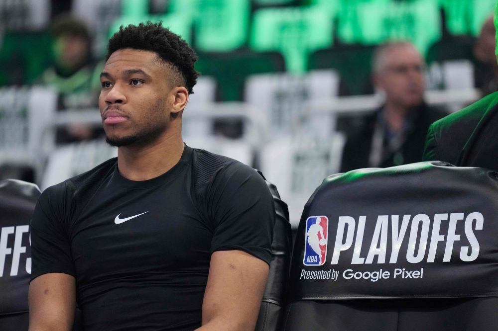 Giannis Antetokounmpo #34 of the Milwaukee Bucks sits on the bench before the start of Game One of the Eastern Conference First Round Playoffs against the Miami Heat at Fiserv Forum on April 19, 2023 in Milwaukee, Wisconsin. (Photo by Patrick McDermott / Getty Images via AFP)