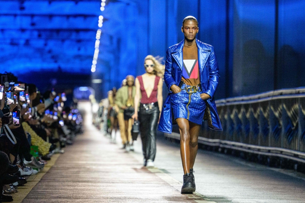 Models wear creations during the Louis Vuitton Pre-Fall 2023 fashion show in Seoul on April 29, 2023. (Photo by ANTHONY WALLACE / AFP)