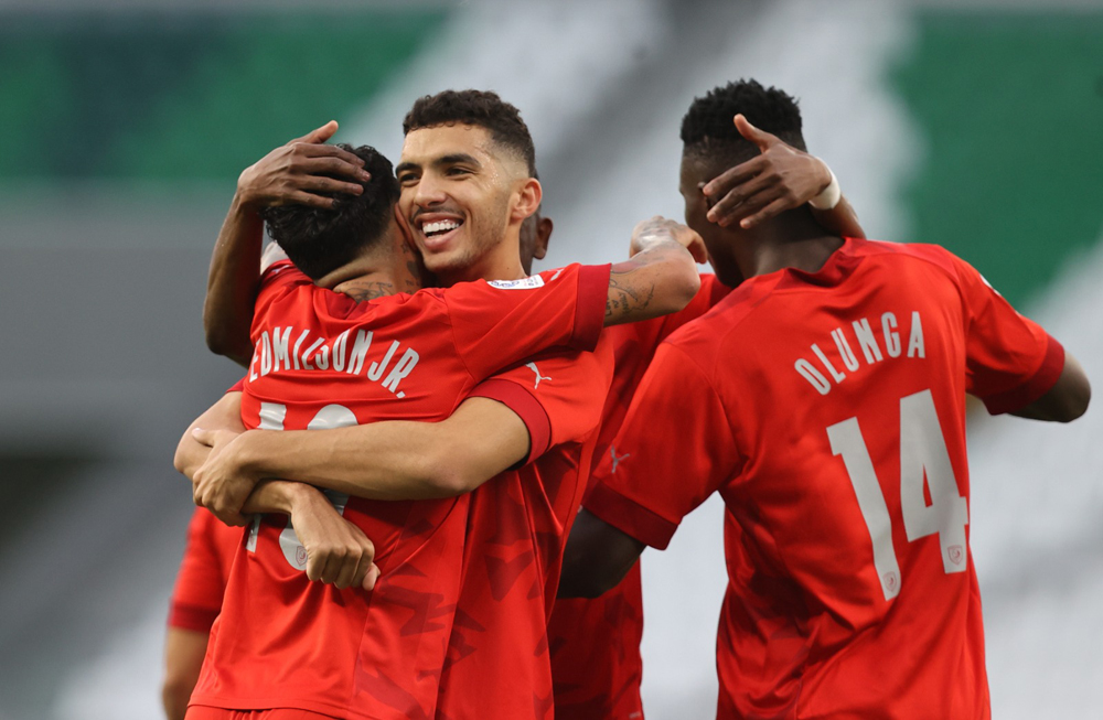 Al Duhail players celebrate their victory against Umm Salal on Saturday.