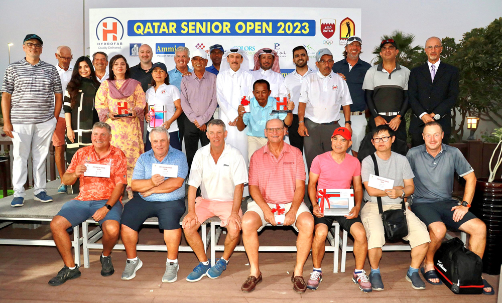 The podium winners of the Qatar Senior Open, pose for a photograph with officials. 