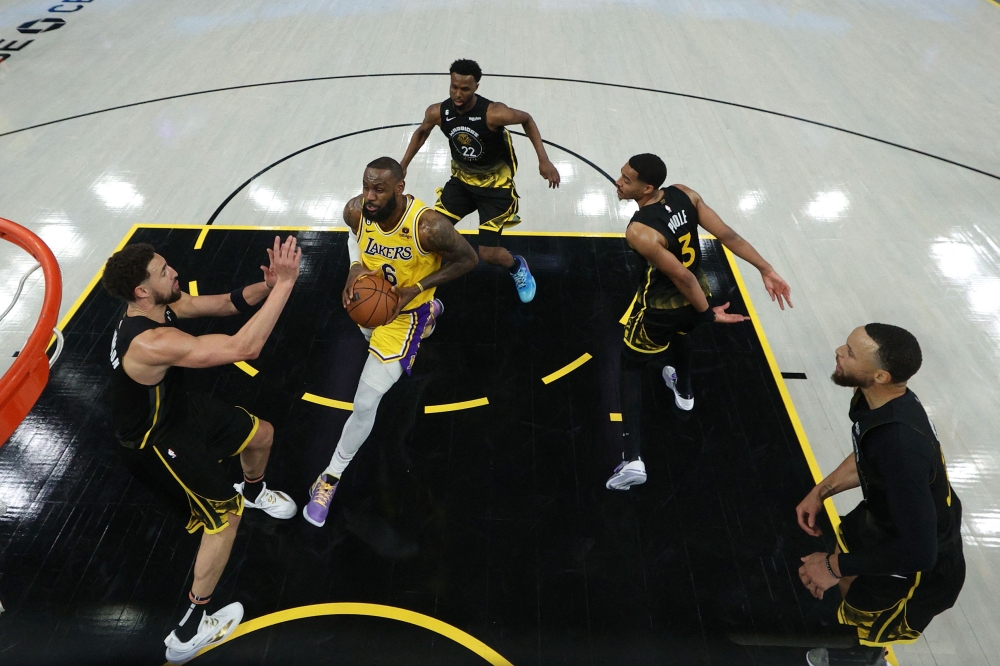 LeBron James #6 of the Los Angeles Lakers drives on Andrew Wiggins #22, Klay Thompson #11, Jordan Poole #3, and Stephen Curry #30 of the Golden State Warriors in game one of the Western Conference Semifinal Playoffs at Chase Center on May 02, 2023 in San Francisco, California.Photo by EZRA SHAW / Getty Images via AFP
