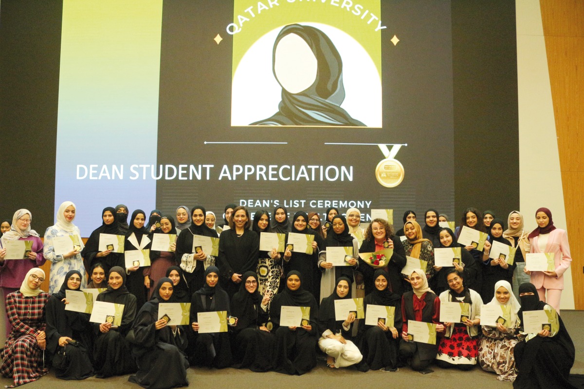 The students pose for photograph during the honouring ceremony at the Qatar University, recently.