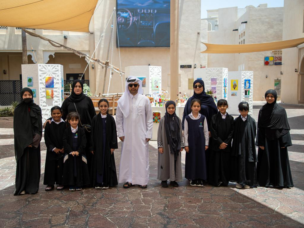 Katara General Manager Prof. Dr. Khalid bin Ibrahim Al Sulaiti, along with the students and officials from Al Arqam Academy for Girls.