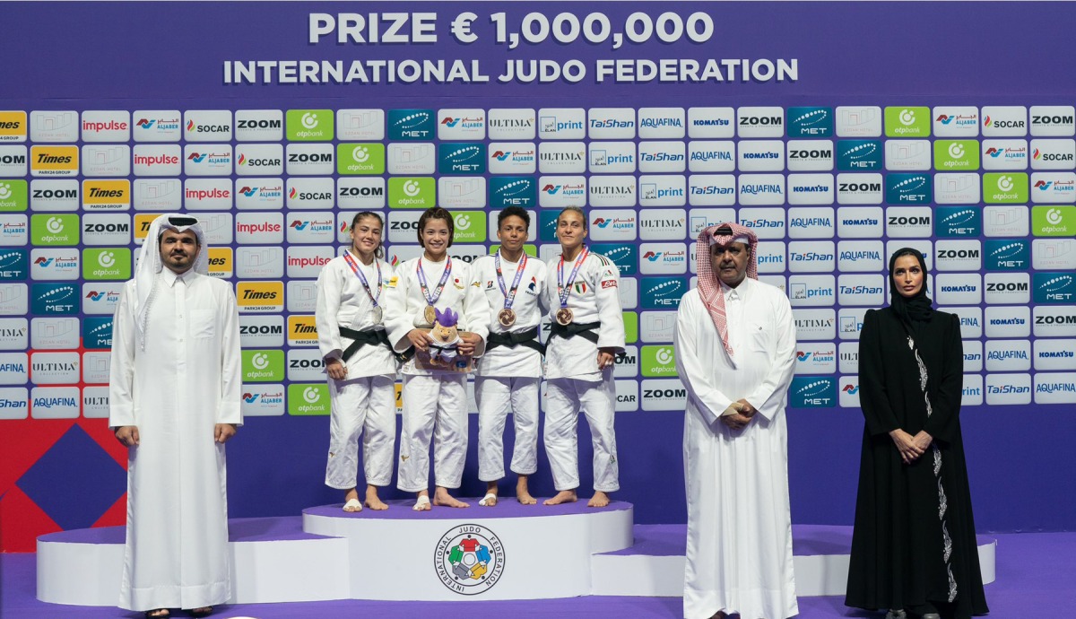 Qatar Olympic Committee (QOC) President and Chairman of the World Judo Championships - Doha 2023 Organising Committee H E Sheikh Joaan bin Hamad Al Thani, President of the Qatar Judo Federation Khalid Al Attiyah and QOC's Amna Alharqan with the podium winners of the women's 52kg weight class. 