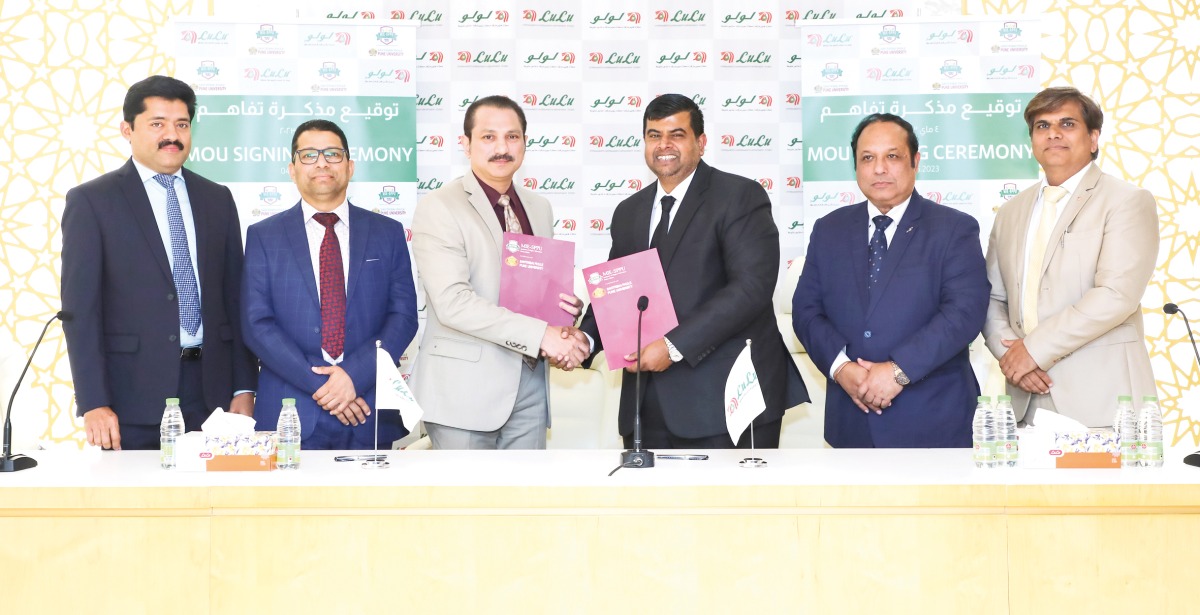 Yasir Nainar, Vice President of MIE-SPPU and Shaijan M O, Regional Director of Lulu Hypermarket, Qatar Region exchanging documents after signing the agreement.