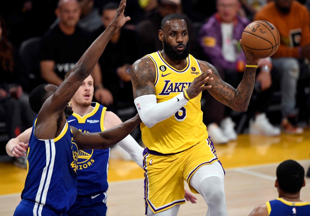 LeBron James #6 of the Los Angeles Lakers is defended by Draymond Green #23 of the Golden State Warriors during the first half of the Western Conference Semifinal Playoffs at Crypto.com Arena on May 12, 2023 in Los Angeles, California. Kevork Djansezian/Getty Images/AFP 