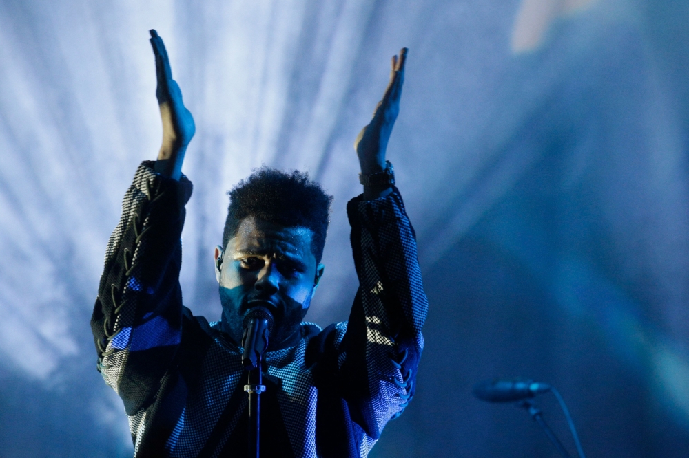  The Weeknd play at the end of the H&M STUDIO SS17 Spring-Summer 2017. (Photo by GEOFFROY VAN DER HASSELT / AFP)
 