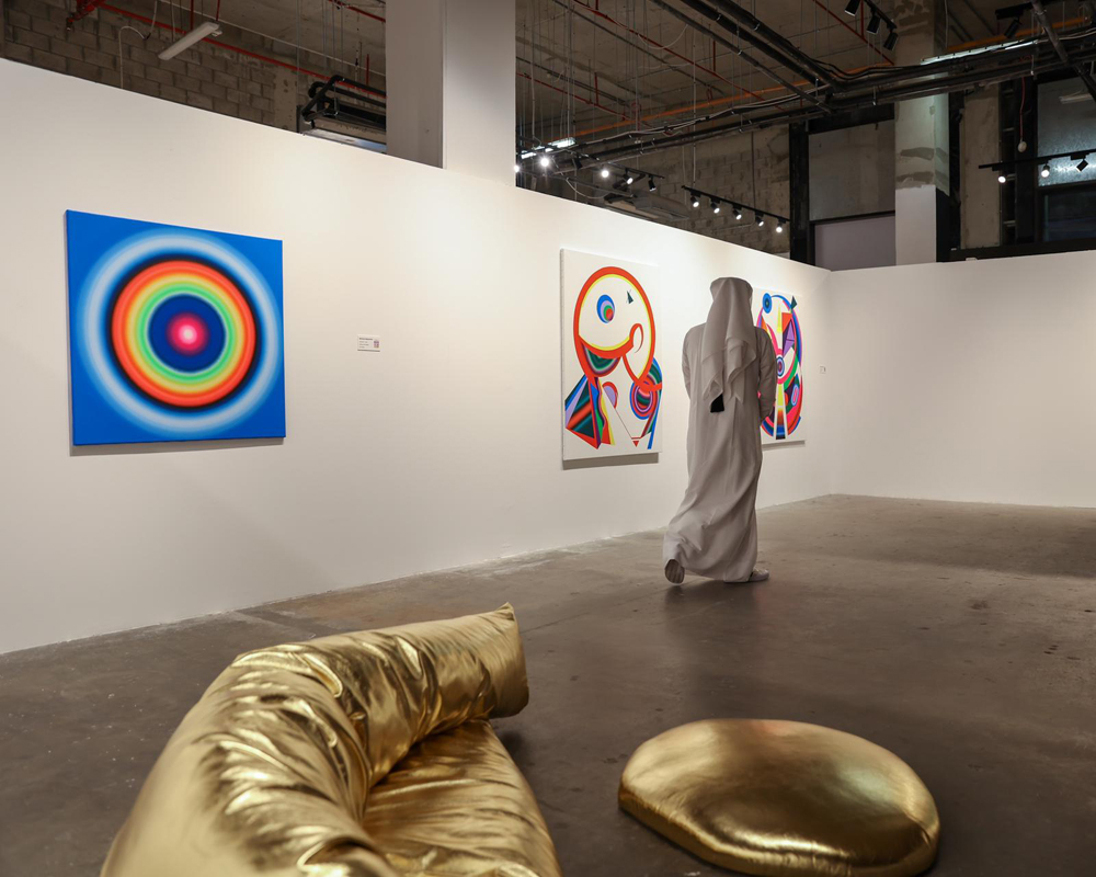 A visitor walks past the artworks at the Anima Gallery in Msheireb Downtown. 