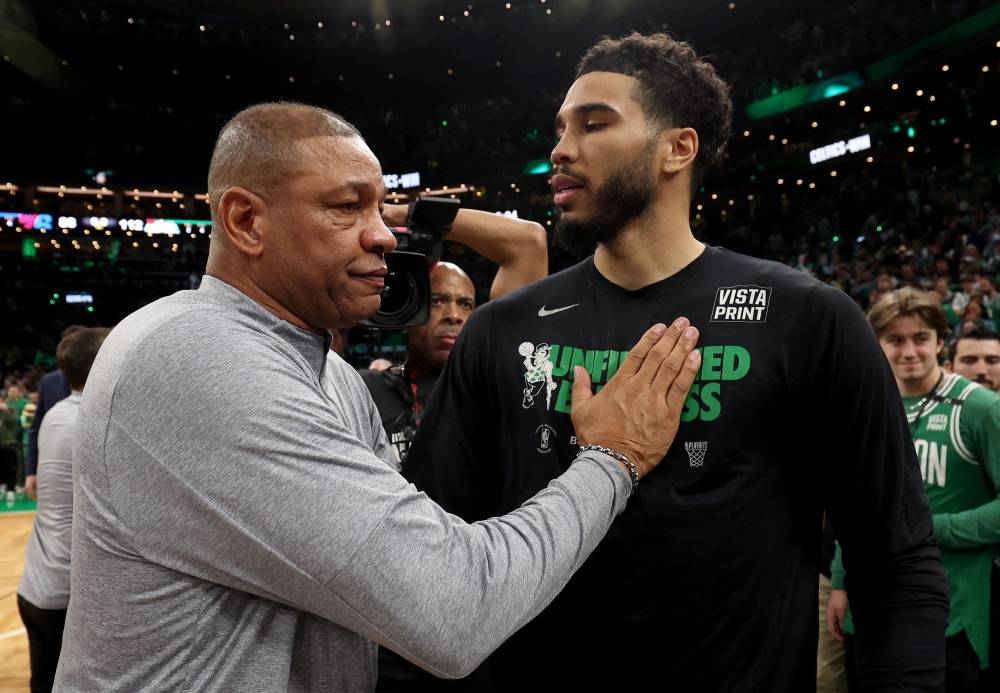 L-R) Head Coach Doc Rivers of the Philadelphia 76ers congratulates Jayson Tatum #0 of the Boston Celtics after game seven of the 2023 NBA Playoffs Eastern Conference Semifinals at TD Garden on May 14, 2023 in Boston, Massachusetts. (Photo by Adam Glanzman / GETTY IMAGES NORTH AMERICA / Getty Images via AFP)
