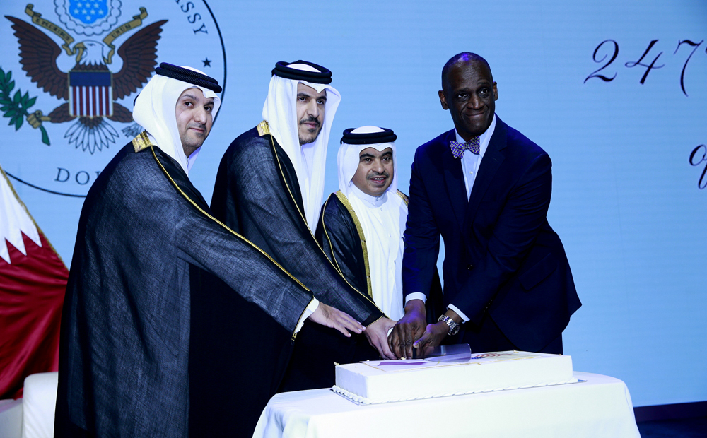 Minister of Finance H E Ali bin Ahmed Al Kuwari (second right), Minister of Commerce and Industry H E Sheikh Mohammed bin Hamad bin Qassim Al Abdullah Al Thani (second left), US Ambassador to Qatar H E Timmy T Davis (right) and Assistant Director of Protocol, Ministry of Foreign Affairs, Saeed Al Hajri, cut the ceremonial cake during the US Independence Day celebrations at QNCC, yesterday. Pics: Rajan Vadakkemuriyil